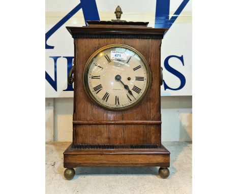 A late Georgian bracket clock in rosewood case with brass finial, ring handles and ball feet, circular convex white dial and 
