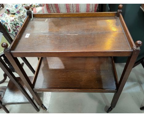 An oak tea trolley; a 19th century bed step/commode; a 1930's wall mirror in canted and beaded oak frame 