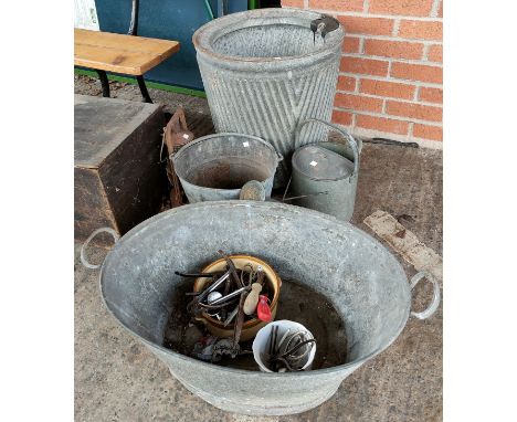 A metal dolly tub and vintage garden equipment