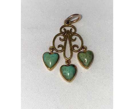 A yellow metal pendant with 3 heart shaped jade coloured drops, unmarked tests as circa 18 ct, 2.5 gm.&nbsp; The drops are tu