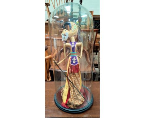 A Far Eastern glass puppet under glass dome, approx 66cm height 