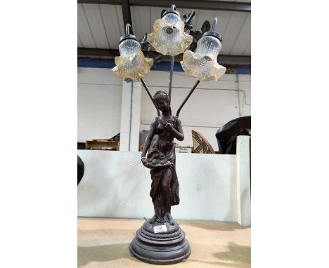 An Art Nouveau style table lamp with 3 branches in the form of a bronzed female figure 