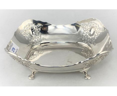 A silver bread dish with pierced decoration, carried on four paw feet, 12.4oz maker HA Sheffield, 1923 