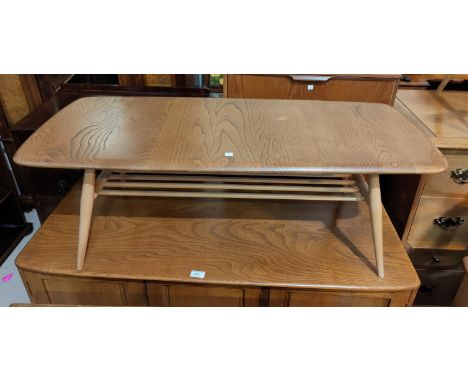 A 1960's Ercol light elm coffee table with undershelf 