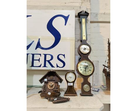 A cuckoo clock; an Edwardian style mantel clock in balloon shaped case; a wall hanging reproduction clock/barometer 