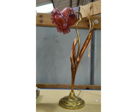 An Art Nouveau brass and copper table lamp with pink glass shade.&nbsp;&nbsp;Good condition. Sold as not working - to be rewi