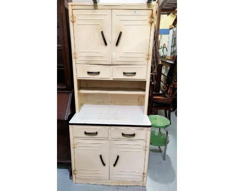 A vintage 1930's white and enamel kitchen cabinet with double doors above and below and 4 drawers, height 189cm, width 84cm 