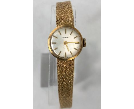 A 9ct gold Garrard ladies dress watch with bark effect strap, baton marks in Garrard box, gross weight 18.8gms.&nbsp;&nbsp;Lo