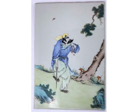 A Chinese porcelain tile with polychrome decoration of man walking with stick, 38 x 25cmIn good condition  