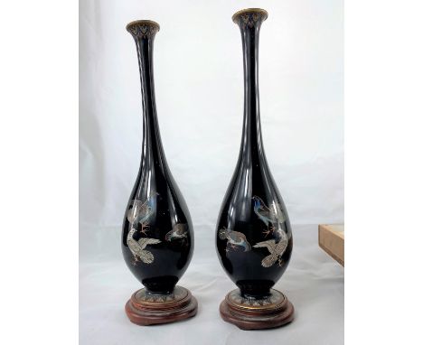 A Japanese pair of fine cloisonné vases of elongated baluster form, with long slender necks, decorated with birds against a d