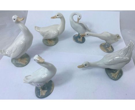 A gaggle of 3 Lladro geese and 3 Nao geese