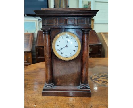 A 19th century French 4 pillar clock in mahogany case with white enamel circular dial and ormolu bezel, with French drum move
