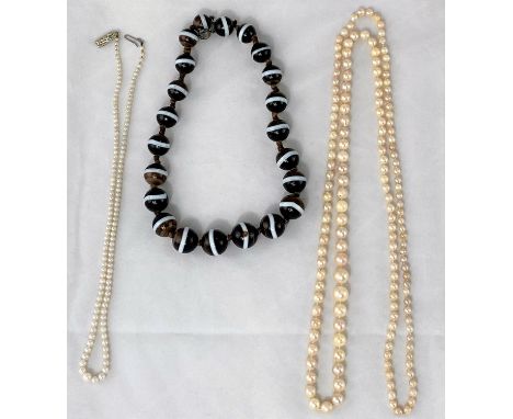 A cultured pearl graduating necklace; a simulated pearl necklace; a necklace formed from triple coloured beads 