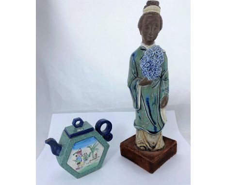 A Chinese ceramic figure of woman in robed and flowers, mounted on velvet stand, height 35cm and Chinese hexagonal teapot wit