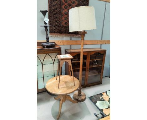 A stained wood standard lamp; a tile top plant stand; a pine occasional table with circular top and pedestal base 