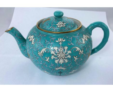 A Chinese ceramic turquoise teapot with stylized floral decoration, gilt highlights, seal mark to base, 22cm Good condition