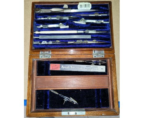 A geometry set contained in a 19th century figured walnut brass bound box 