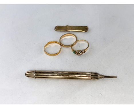 A 22 carat wedding ring size 'N', 1.5 gm (a.f.); a brooch stamped '9ct'. 1.4 gm (a.f.); a wedding ring stamped '18ct' size 'M