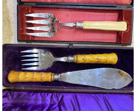 A pair of Victorian Aesthetic Movement period fish servers, carved bone handles with diamond registration mark, cased, a case