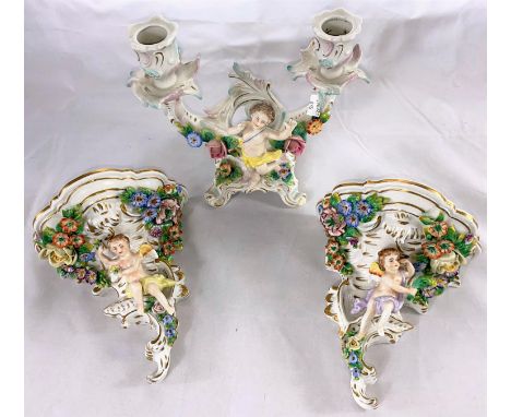 A pair of Capodimonte encrusted wall brackets; an encrusted mantel clock; similar china 