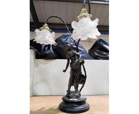 An Art Nouveau style table lamp with 2 branches in the form of a bronzed female figure 