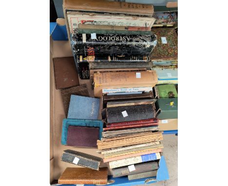 A selection of vintage tins; a selection of books on astrology; etc.