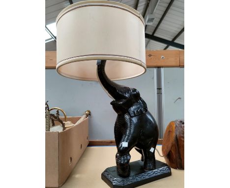 A large ebonised elephant table lamp.&nbsp;Early to mid 20th century