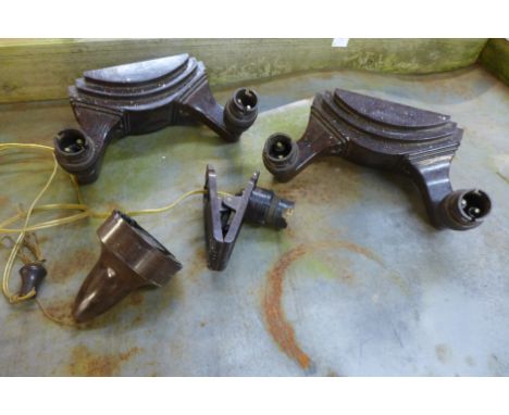 Two Bakelite wall lights, a pull switch and a clip-on Bakelite light 