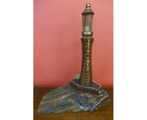 A carved wood lighthouse table lamp 