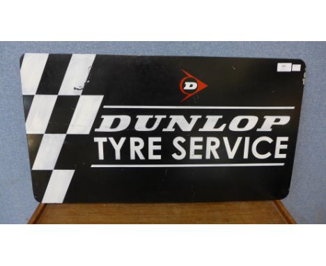 A painted Dunlop Tyres Service sign 