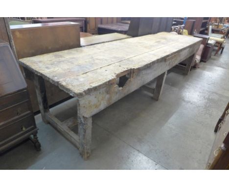 A large industrial pine work bench 