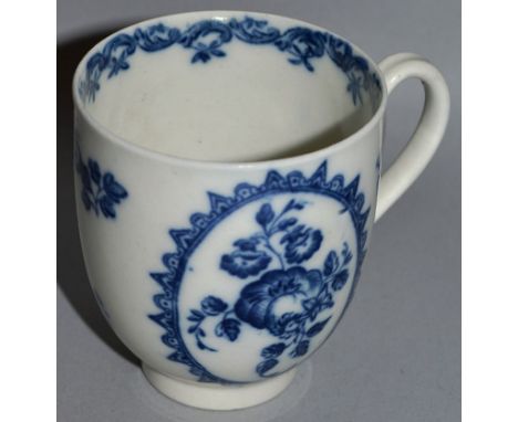 A WORCESTER COFFEE CUP decorated with fruit in an inner border, flowers and an outer border, crescent mark (52).