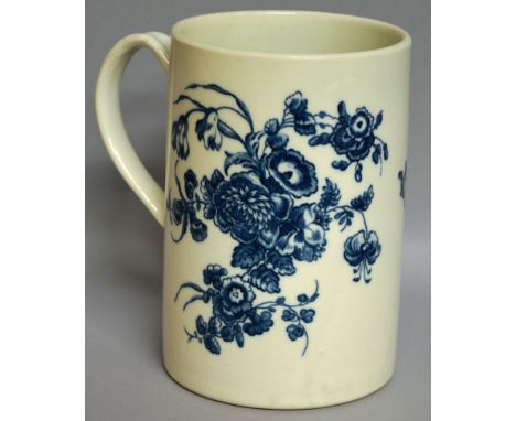 A LARGE WORCESTER CYLINDRICAL MUG decorated with large floral sprays in under-glaze blue (53).