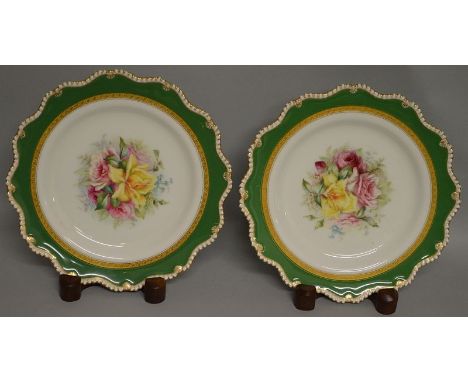 A ROYAL WORCESTER FINE PAIR OF PLATES painted with rose under an apple green ground, date code for 1906 (Harry Chair’s roses 