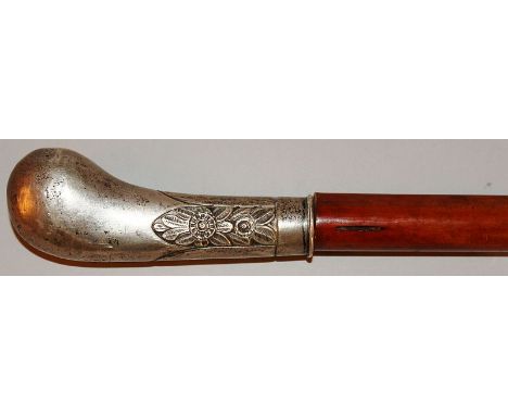 A SILVER HANDLED WALKING STICK.