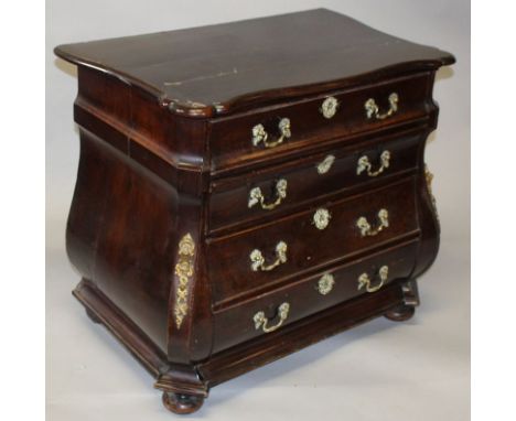 AN 18TH CENTURY DUTCH MAHOGANY BOMBE COMMODE, with a shaped top over four long drawers with later rococo ormolu handles, supp