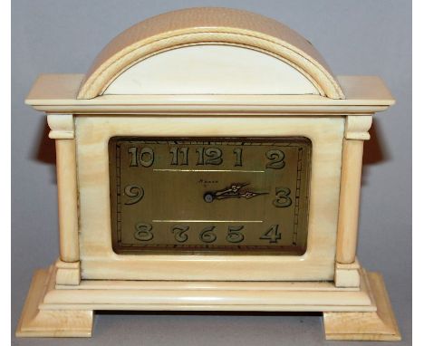 A GOOD ART DECO IVORY CLOCK with eight day movement, domed top and bracket feet 4.5ins high.