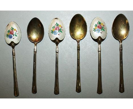 A SET OF SIX ENAMEL BACK COFFEE SPOONS in a fitted case.