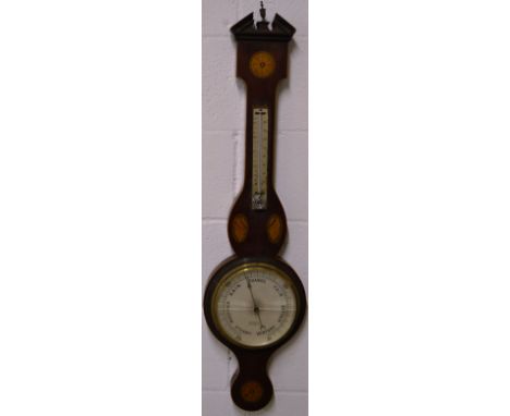 AN EDWARDIAN MAHOGANY INLAID BAJO BAROMETER by H ROBINS, FARNHAM, 8-inch dial with thermometer 3ft 4ins long.