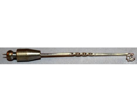 A 9CT GOLD AND DIAMOND STICK PIN.