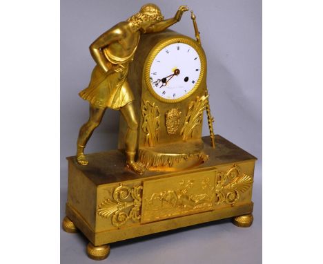 A GOOD EMPIRE ORMOLU MANTLE CLOCK by STIENNON a PARIS, with eight day movement and circular enamel dial, striking on a single