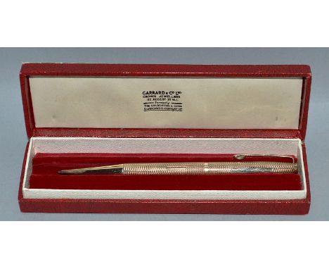 A GARRARD 9CT ENGINE TURNED PROPELLING PENCIL in original box and a 14k gold propelling pencil (2).