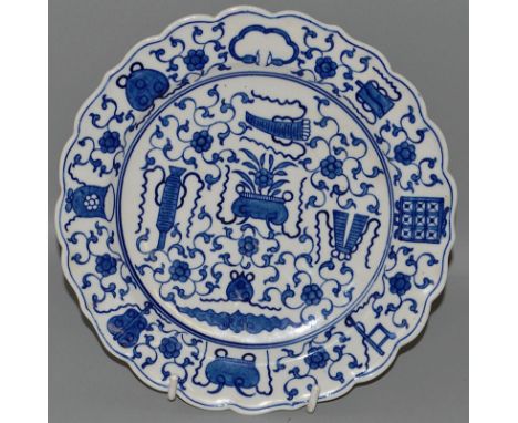 A WORCESTER PLATE decorated with Oriental symbols and precious objects, Chinese style character mark to reverse (58).