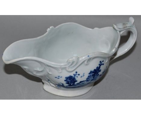 A LIVERPOOL SCROLL MOULDED CREAMBOAT decorated with Chinese landscapes (32).