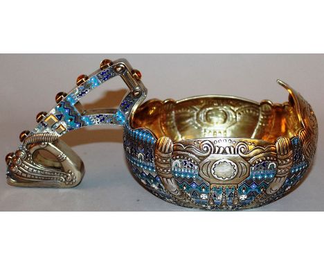 A SUPERB RUSSIAN SILVER AND ENAMEL KOVSH with shades of blue enamel and various motifs, the handle inset with six cabochon st