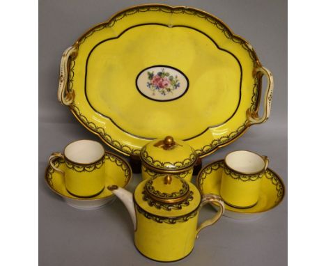 A SEVRES YELLOW GROUND MORNING TEA SET, comprising two handled tray, teapot, sugar basin and two cups & saucers.