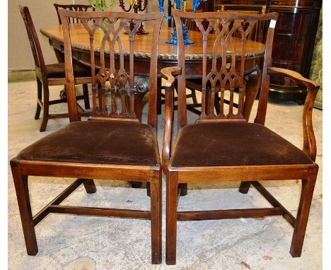 A GOOD SET OF SIX GOTHIC CHIPPENDALE MAHOGANY DINING CHAIRS, two with arms, curving top rail, interlaced Gothic splats, drop 