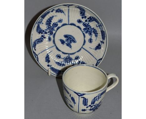 A WORCESTER COFFEE CUP AND SAUCER decorated with a Meissen Onion style pattern, crescent mark (15).