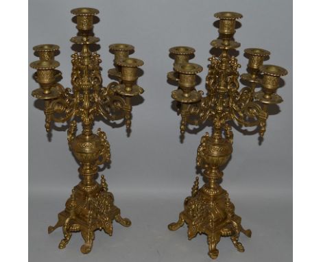 A PAIR OF 19TH CENTURY FRENCH FIVE LIGHT CANDELABRA with four scrolling branches 17ins high.