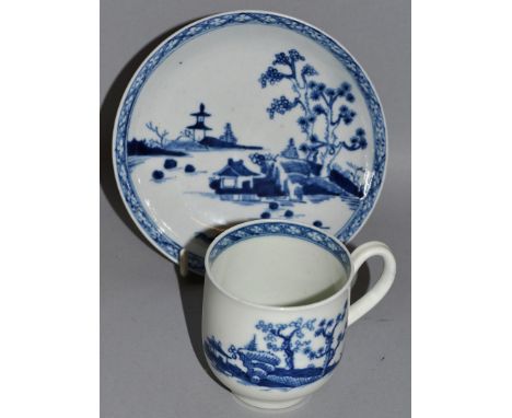 A WORCESTER COFFEE CUP AND SAUCER decorated with a man in pagoda, and two islands, crescent mark (21).
